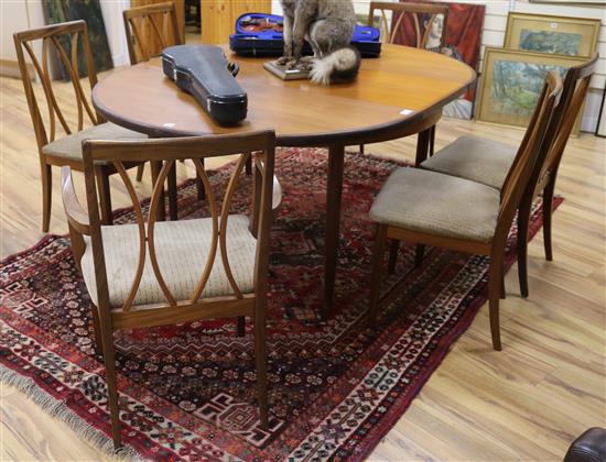 A G Plan teak extending table and six chairs including two carvers